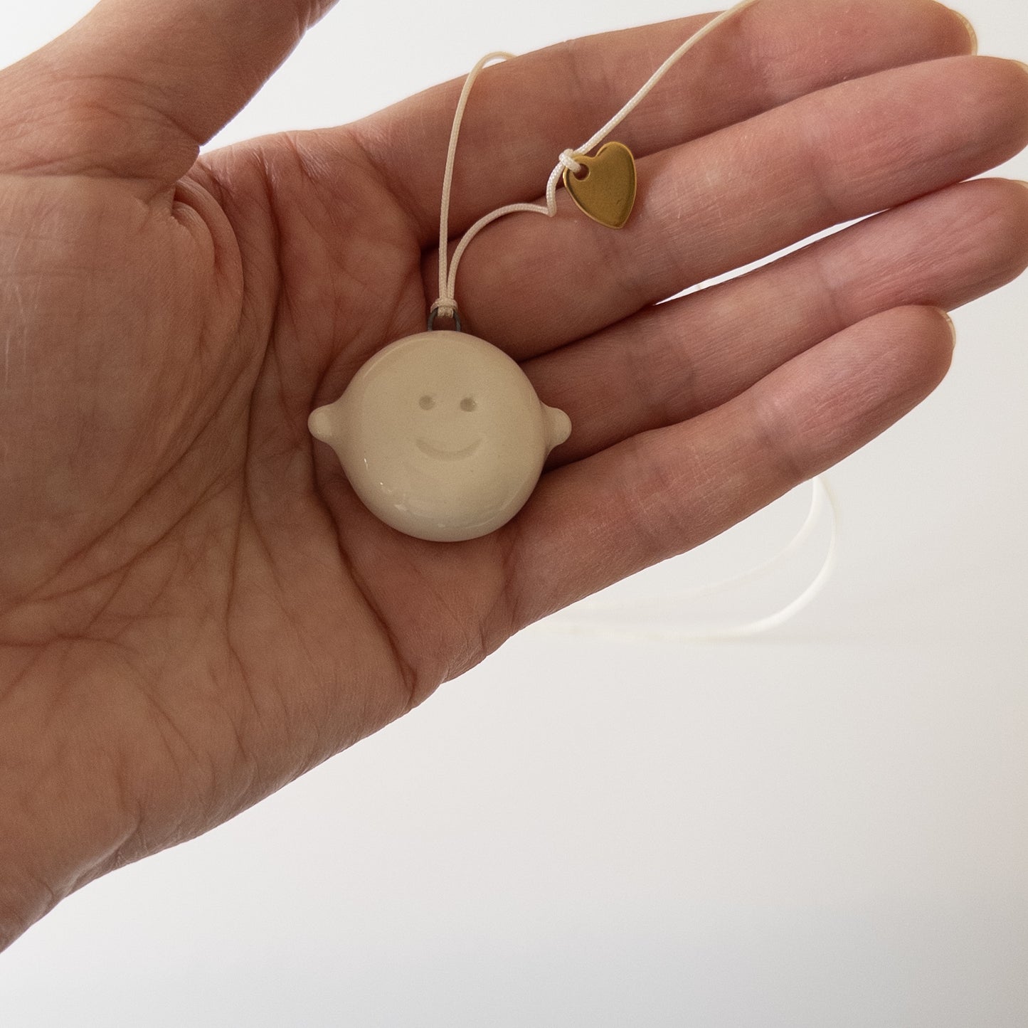Double-sided ceramic pendant Smiley face + metal heart