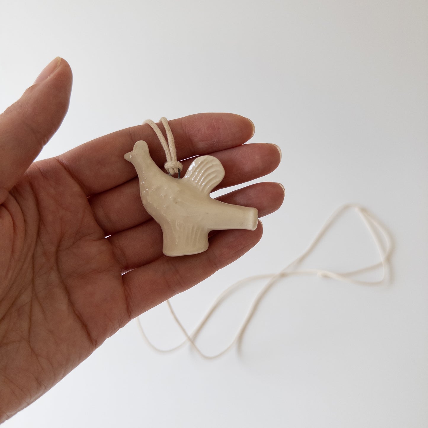 Ceramic pendant in the shape of a Chicken whistle