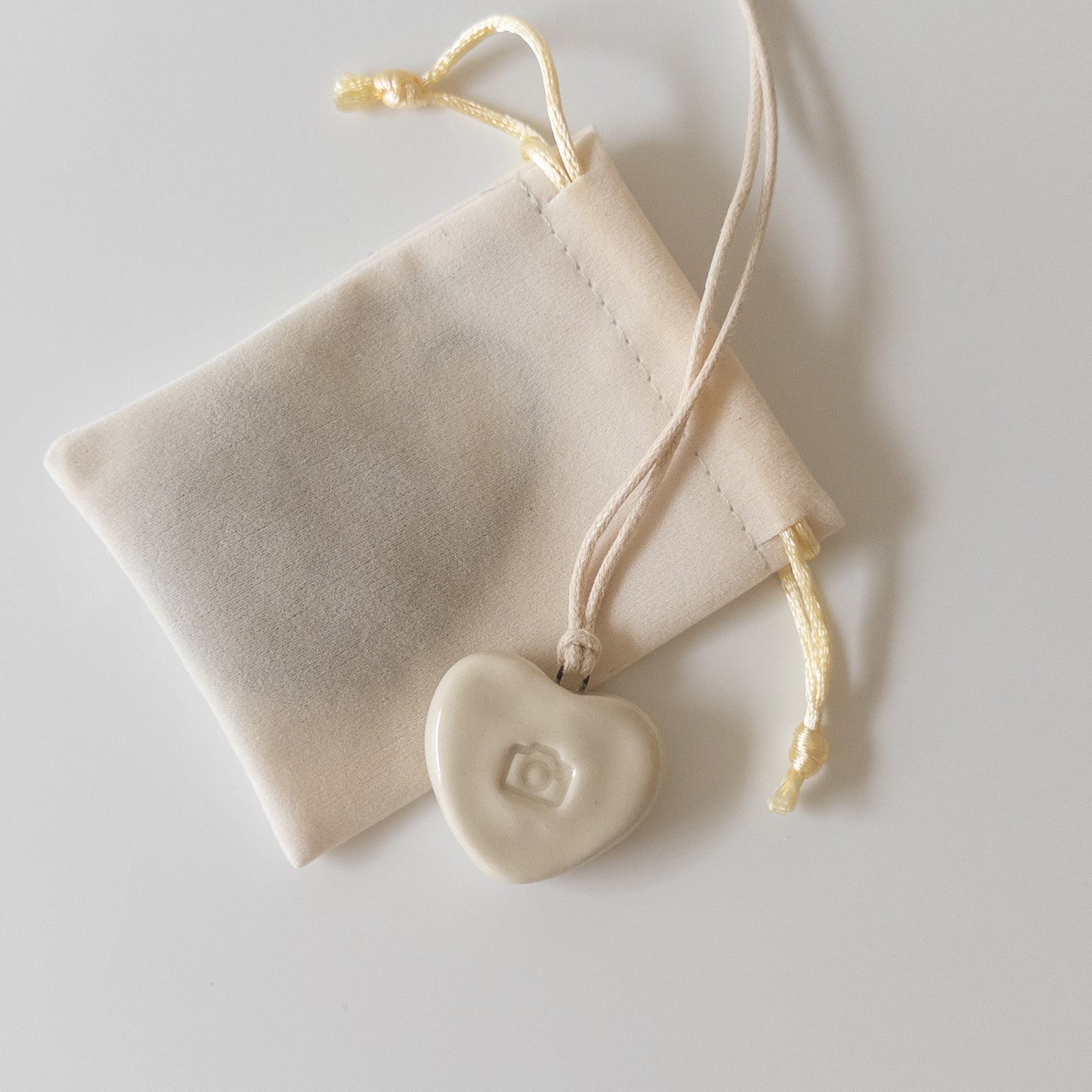 Ceramic pendant Heart with a camera