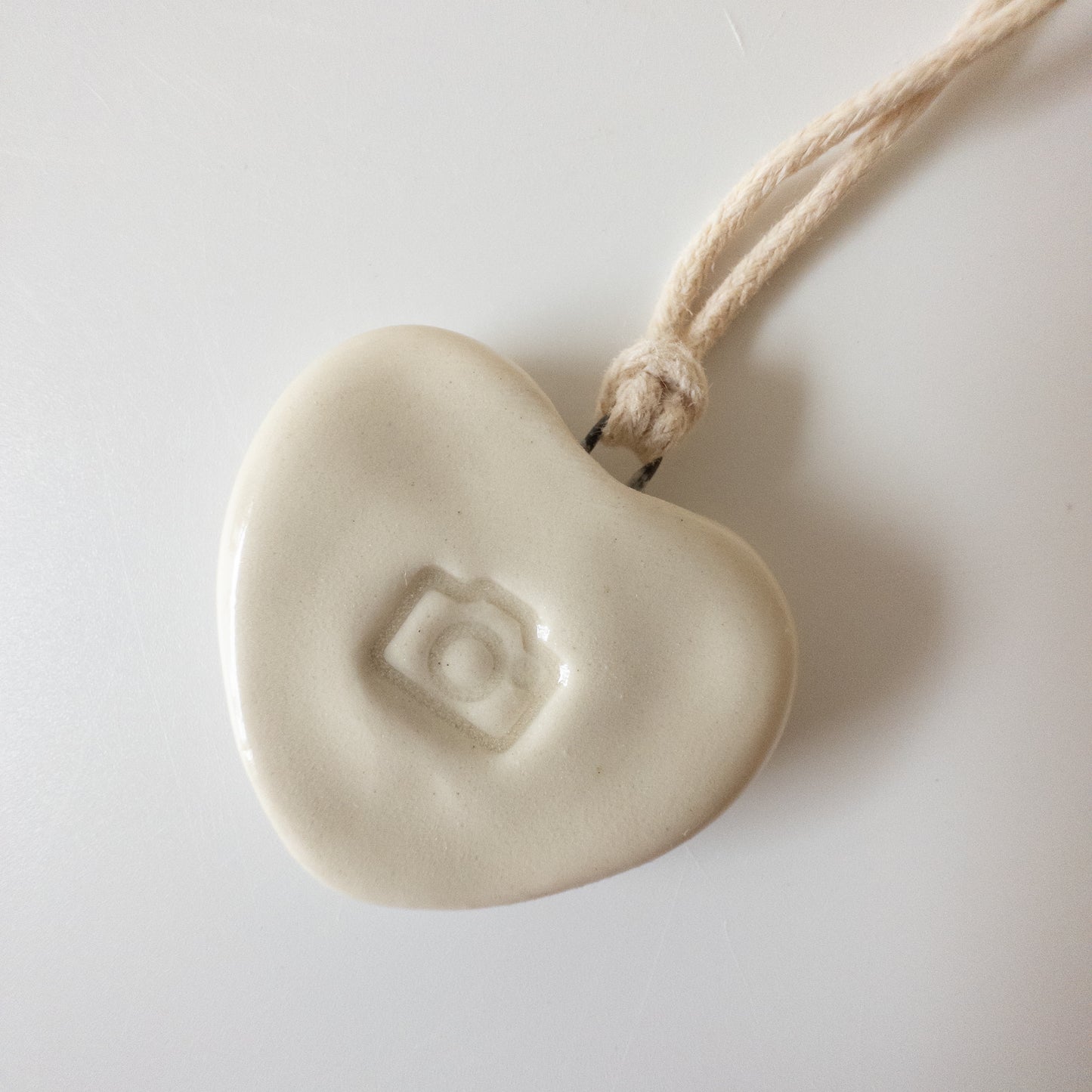 Ceramic pendant Heart with a camera