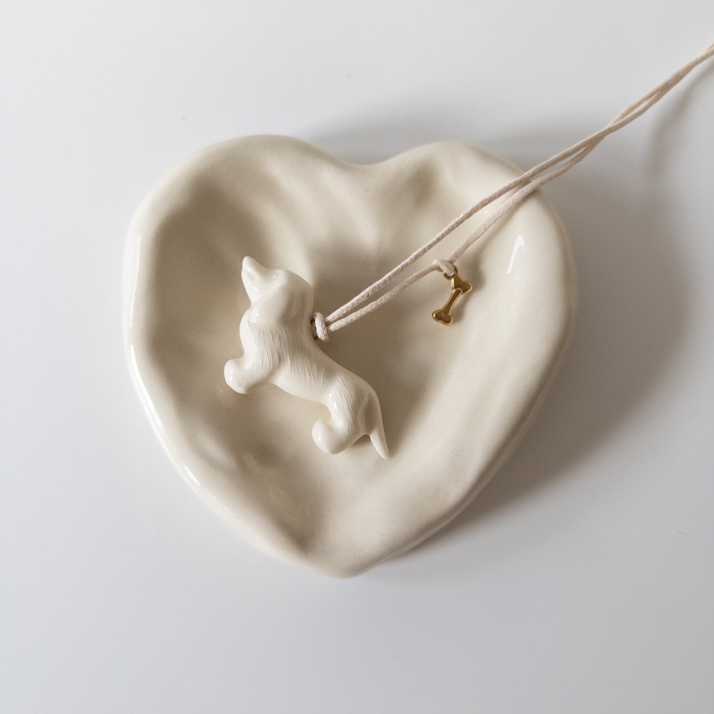 Керамічний підвіс Такса з металевою кісточкою