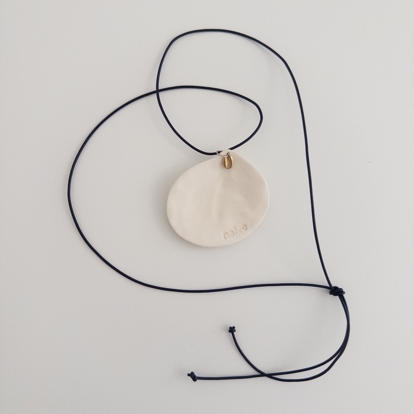 Oversized shell on a leather cord